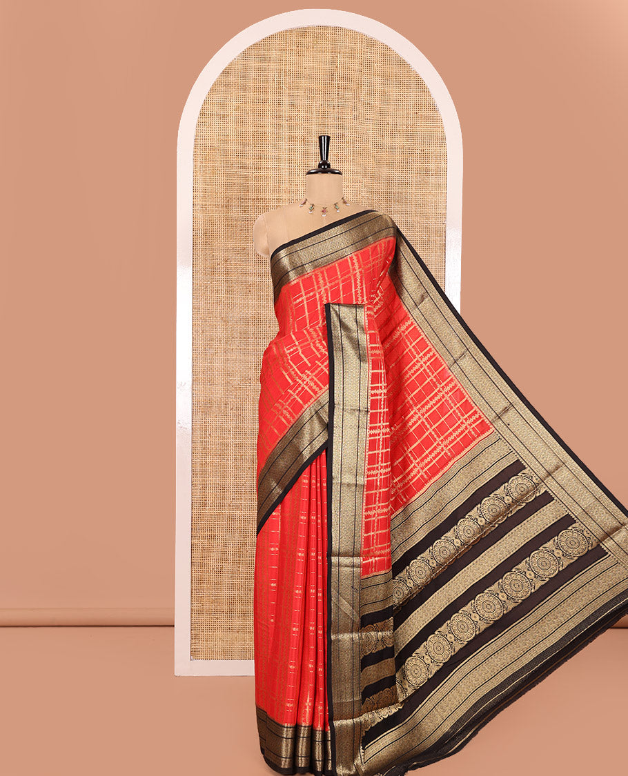 Red and Black Semi-Mysore Silk Saree Enriched with Intricate Zari Checks on Its Body, Complemented by a Contrast Geometric Patterns Zari Woven Border, Pallu Spotlighted with Chakram Motifs, and Paired with a Contrast Blouse