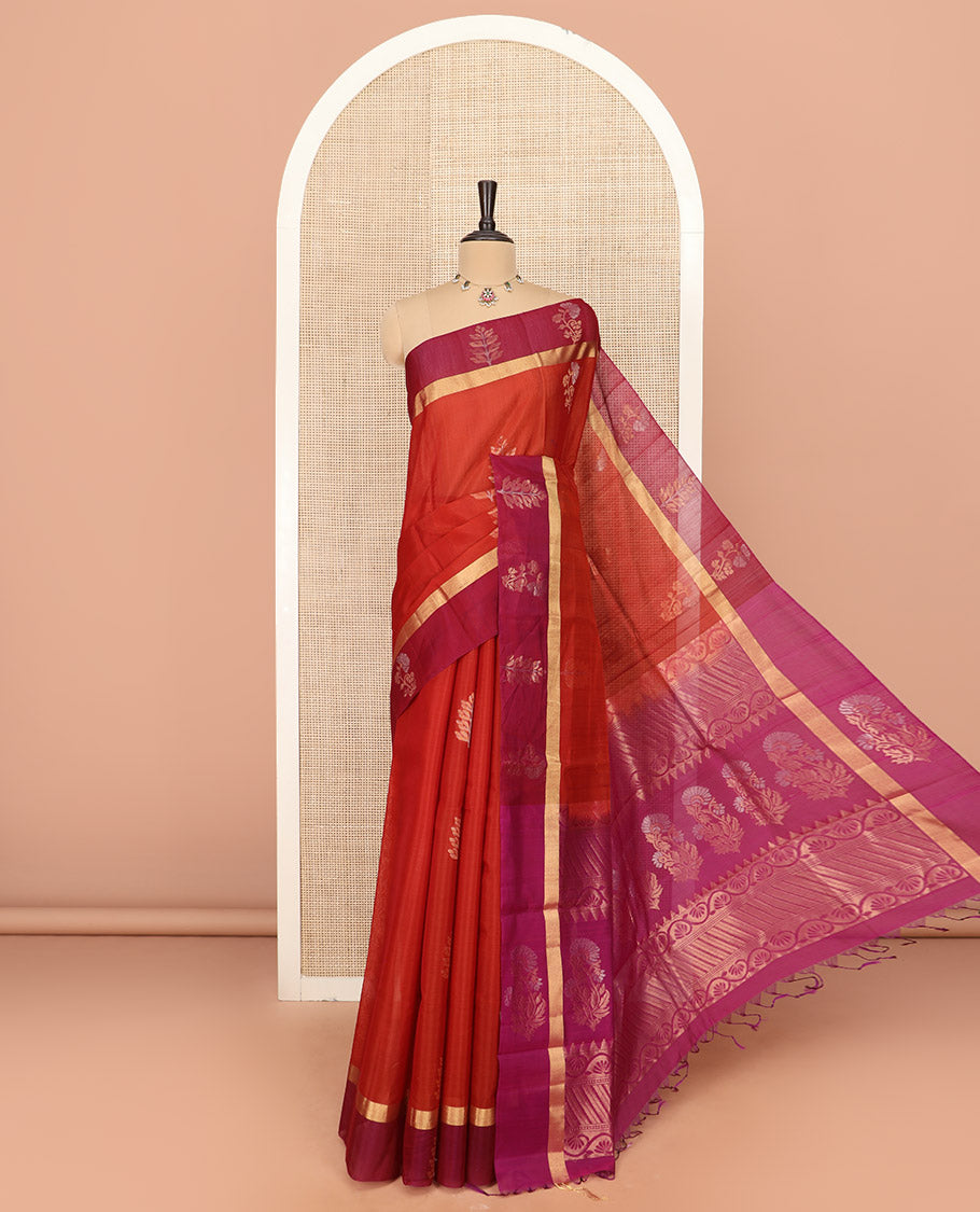 Orange Silk Cotton Saree Graced with Floral Buttas All Over the Body, Complemented by a Contrast Floral Zari Motifs Woven Border, Featuring a Contrast Pallu of Floral- Geometric Zari Designs, and Paired with a Contrast Blouse