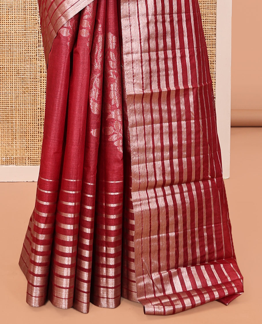 Borderless Red Tussar Silk Saree, Elegantly Framed with Zari Stripes and Floral Buttas, Striped Pallu, and a Matching Blouse