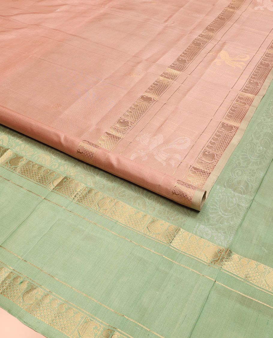 Pastel Pink Uppada Silk Saree Woven with Floral Buttas, Captivating Contrast Border of Traditional Zari Motifs and Peacock Motifs, Pallu Depicting Floral Jaal Design, and Paired with a Contrast Zari-Bordered Blouse