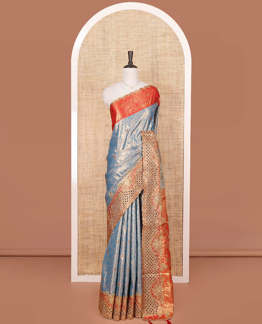 Blue Vastrakala Silk Saree, Adorned with Floral Jacquard and Stone Work, Complemented by Contrast Traditional Zari and Cut Embroidered Scallop Border, Gleaming Grand Zari-Stone Work Pallu, and Paired with Contrast Heavy Stone Embroidered Blouse