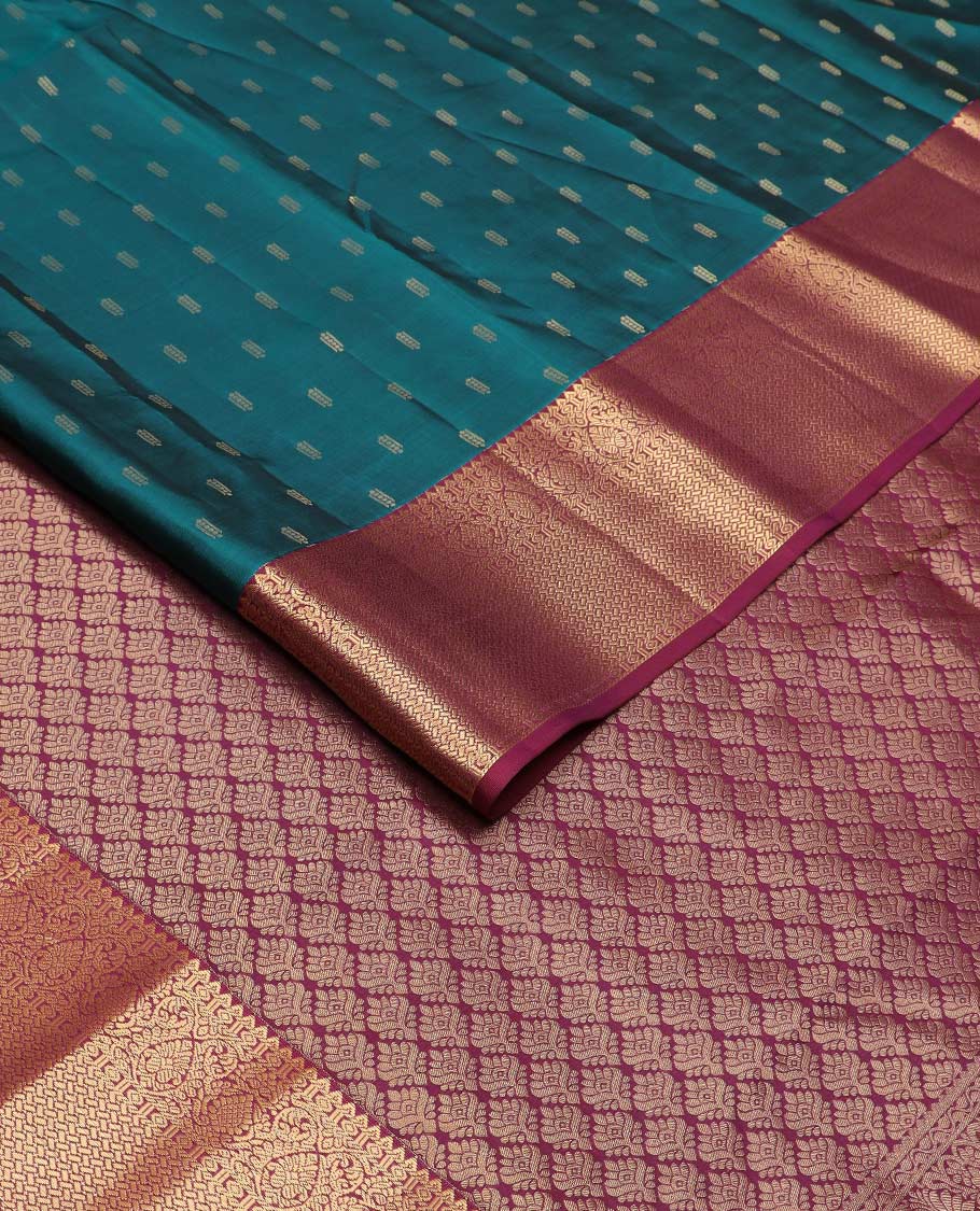 Blue zari buttas Vasundhara silk mix saree, contrast border of rekku, diamond, thilakam, and paiyaadi kattam, and intricate pallu