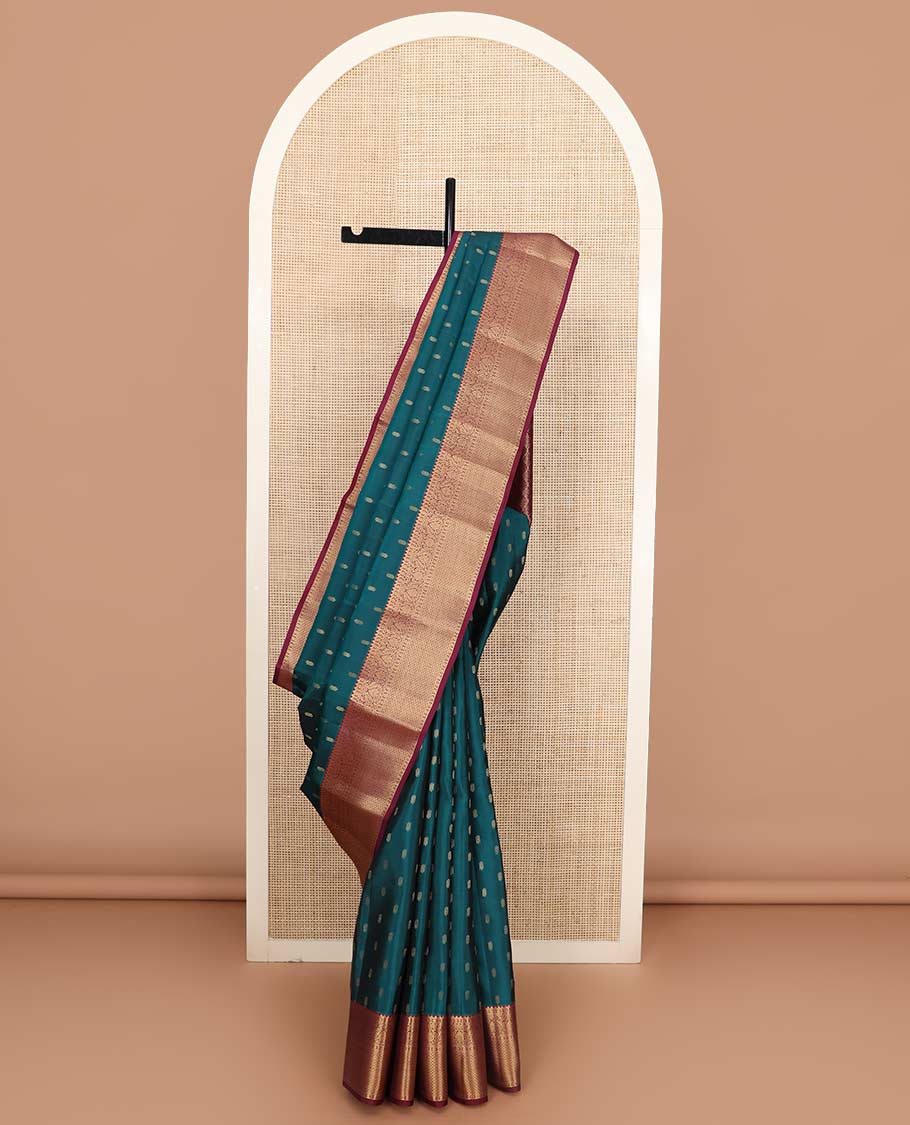 Blue zari buttas Vasundhara silk mix saree, contrast border of rekku, diamond, thilakam, and paiyaadi kattam, and intricate pallu