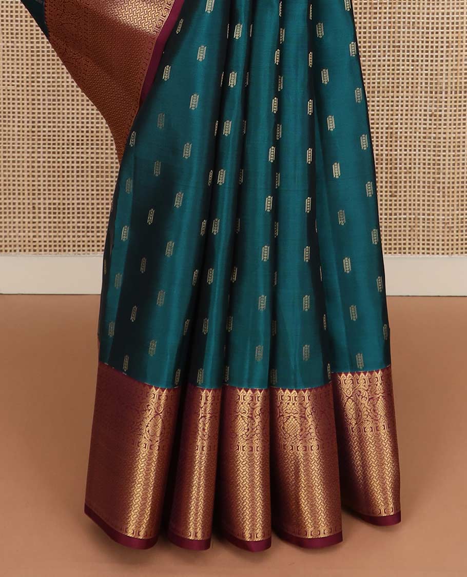 Blue zari buttas Vasundhara silk mix saree, contrast border of rekku, diamond, thilakam, and paiyaadi kattam, and intricate pallu