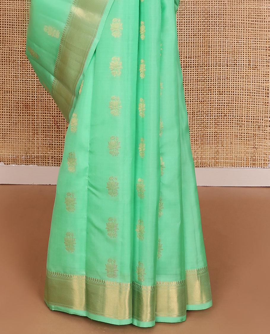 Green zari buttas Vasundhara elite silksaree, zari border of thilakam mokku, neli & zari stripes & contrast jaal pallu