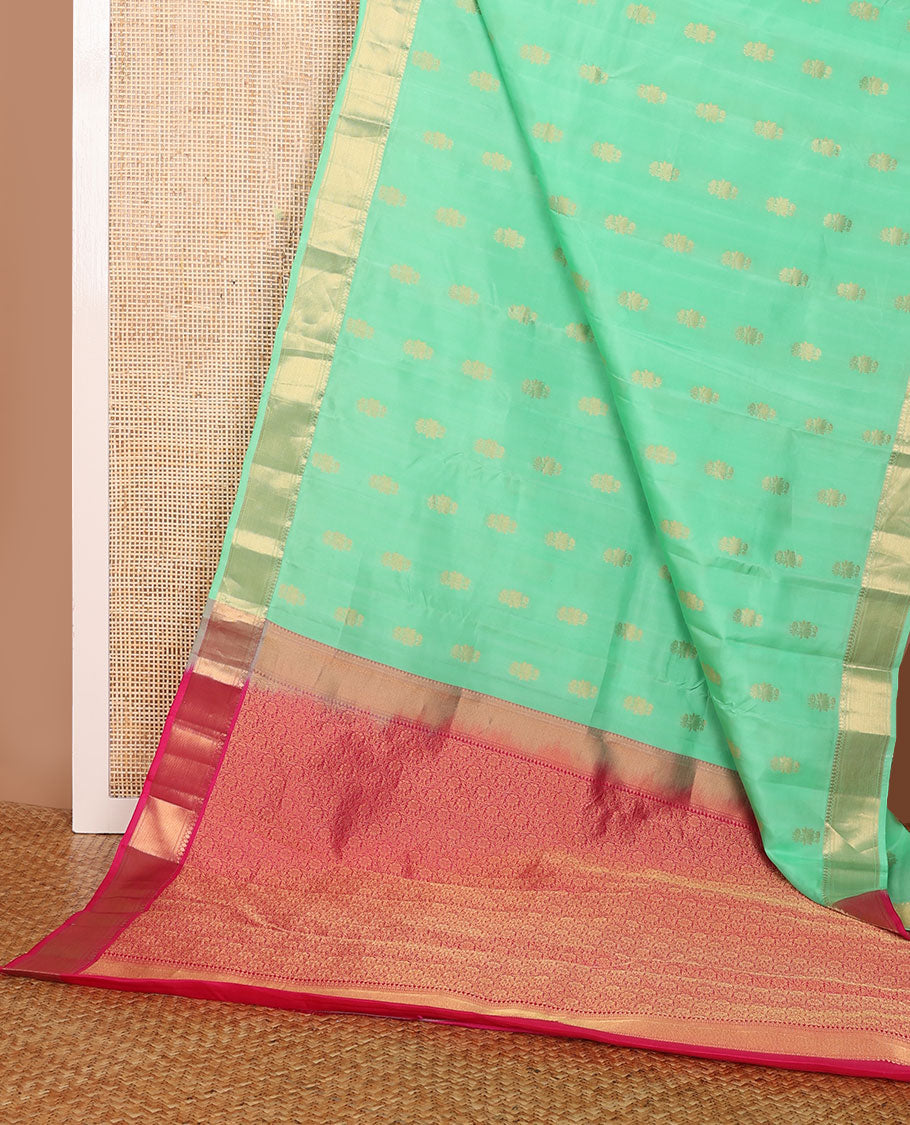Green zari buttas Vasundhara elite silksaree, zari border of thilakam mokku, neli & zari stripes & contrast jaal pallu