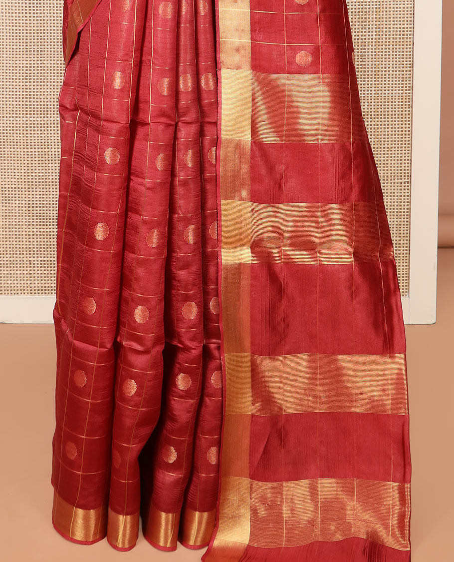 Red Banana Pith Saree Mesmerized with Polka Dot Buttas Enclosed Checks, Subtle Zari Border, Gleaming Zari Stripes Woven Pallu, and Paired with a Matching Plain Blouse