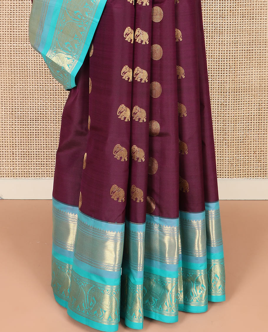 Purple Vasundhara Silk Saree Beautified with Yaanai and Poun Buttas, Complemented by a Contrast Border of Neli, Mayil Kann, Muthu, Banaras, and Yaanai Designs, Pallu Woven in Jaal Design, and Paired with a Contrast Blouse
