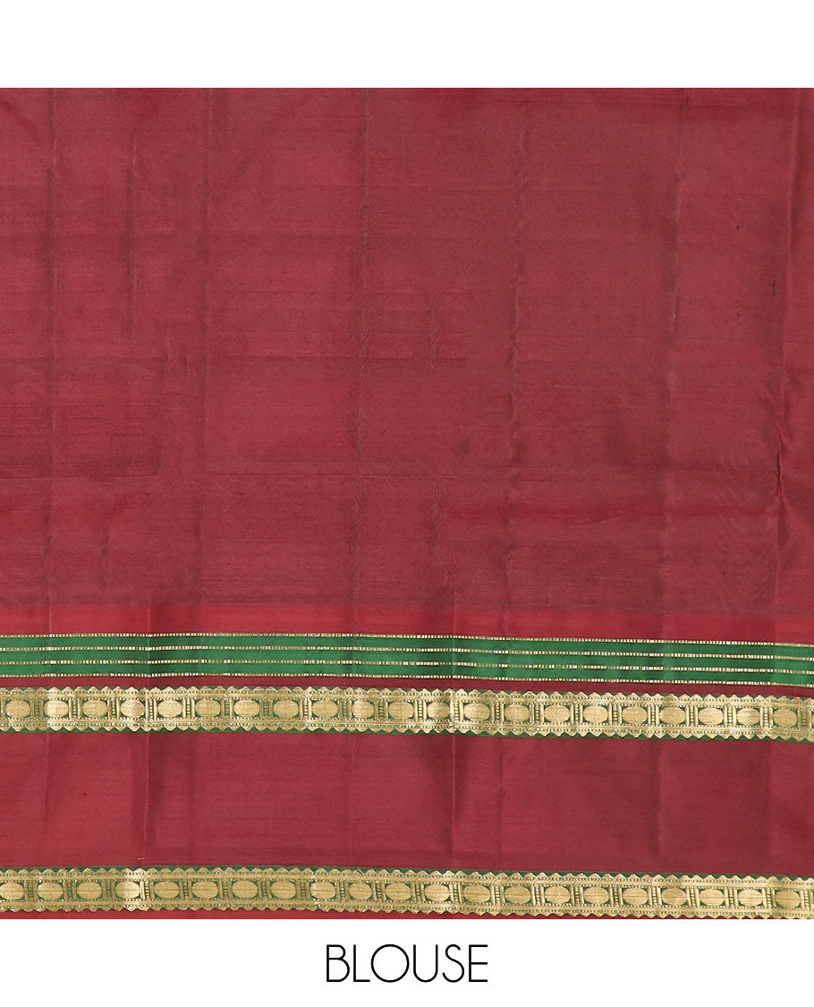 Brown Vasundhara Silk Saree Richly Detailed with Zari Buttas, Complemented by a Contrast Varisai Pettu Border of Muthu, Rekku, and Rudraksham Designs, Intricately Designed Pallu, and a Contrast Blouse