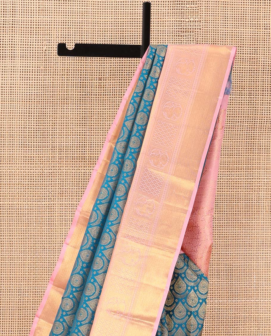 Blue jacquard wedding silk saree, contrast zari border of neli, banaras, jaal, and mayil designs, and floral design pallu