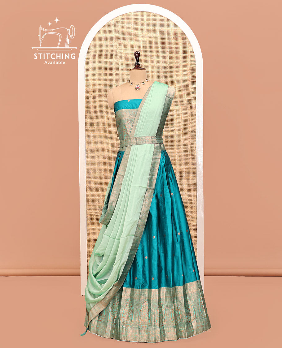 Peacock Blue Art Silk Half Saree Features Buttas Steeped Skirt, Complemented by Contrast Traditional Border, Contrast Blouse, and a Embroidery Scallop Dhavani