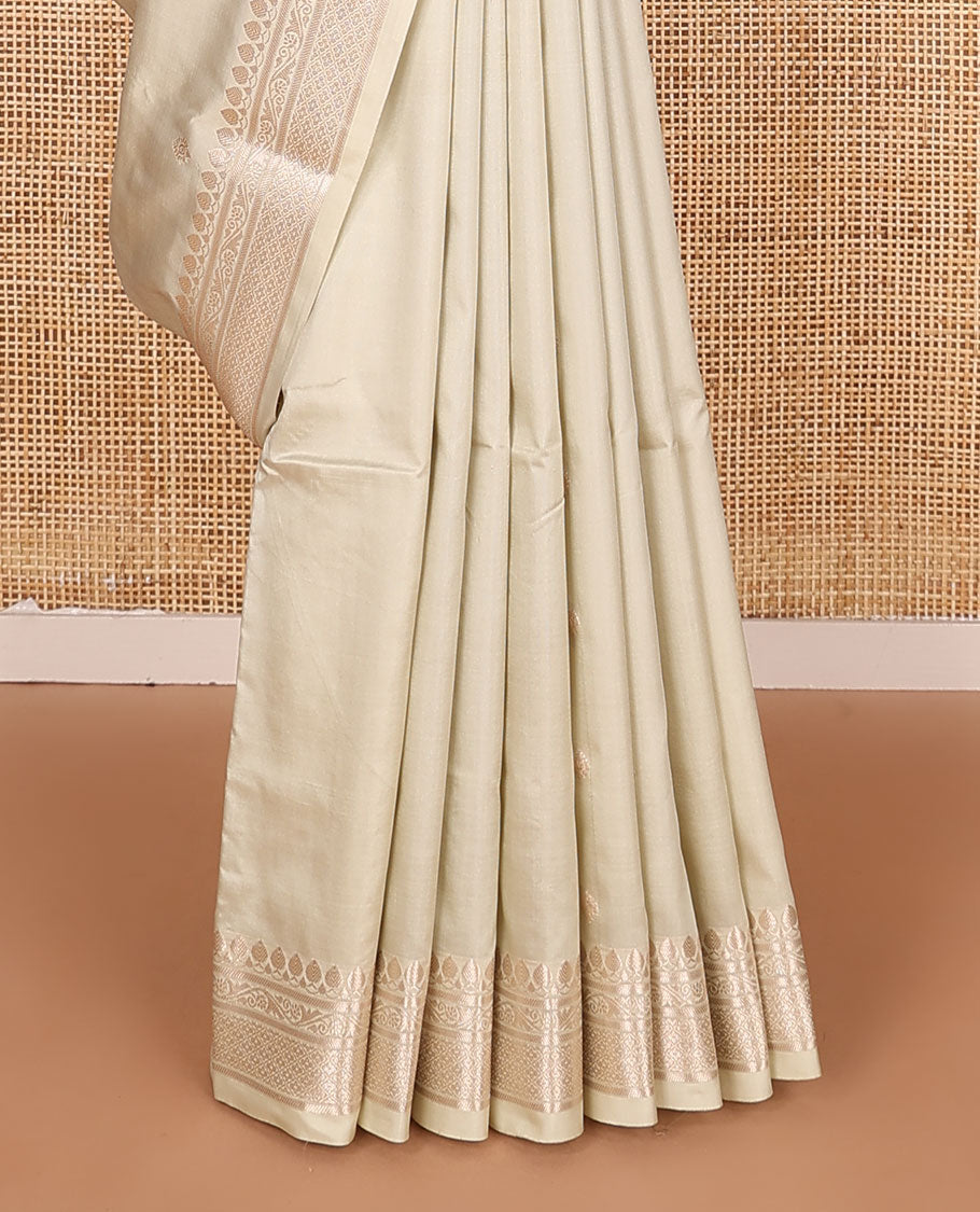 Cream buttas kathan silk saree, traditional zari border, and intricately designed pallu