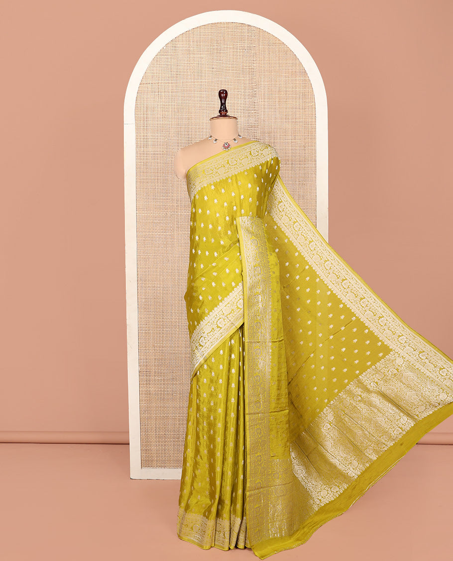 Green Fancy Crepe Saree, Finely Crafted with Buttas, Highlighted by a Floral Creeper Border, Intricately Designed Pallu, and a Matching Blouse