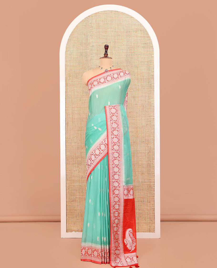Green Banarasi Georgette Saree, Adorned with Zari Buttas All Over Its Body, Complemented by a Contrast Floral Creeper Design Border, Pallu of Paisleys, and Paired with a Contrast Blouse