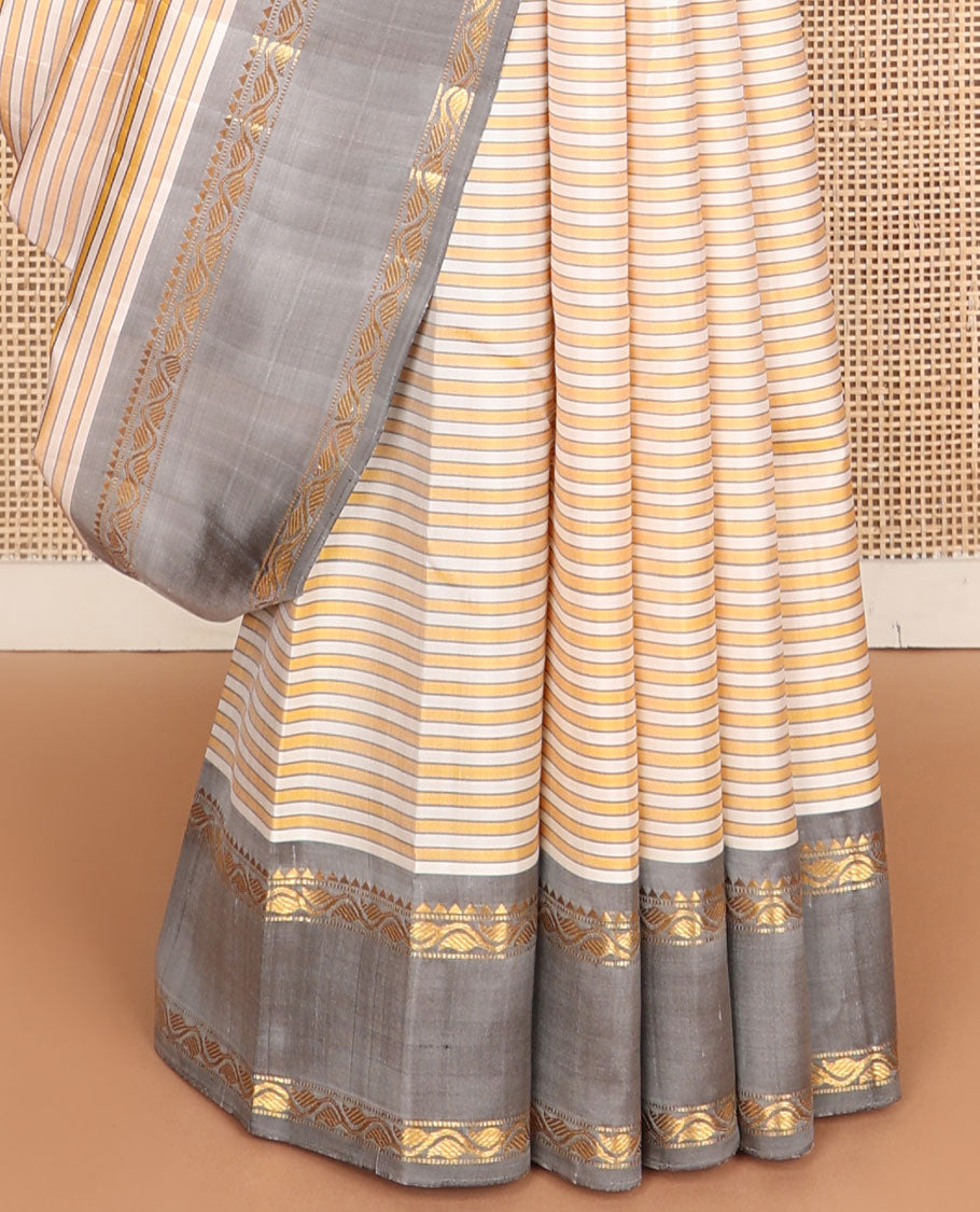 Yellow-white striped kanchipuram silk saree, contrast rettai pettu border of rekku, muthu & leaf vine & pallu of zari stripes