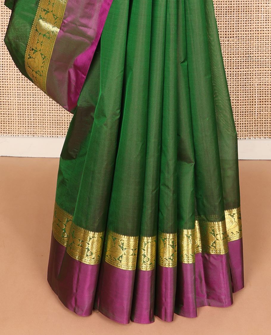 Green dual-tone zari buttas silk saree, contrast border of salngai, rudraksham,vanki & mayil & zari design pallu