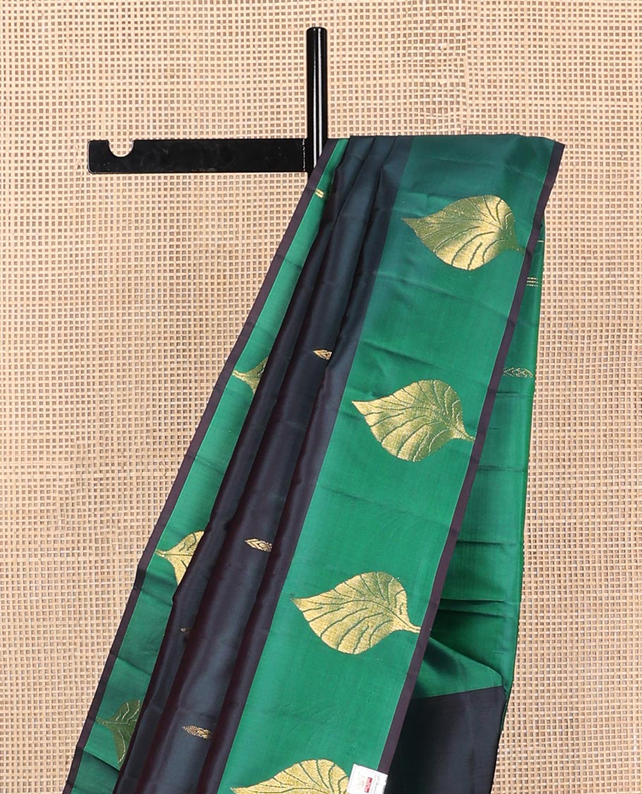 Blue zari buttas Kanchipuram silk saree, contrast leaf motifs zari border, and floral zari design pallu