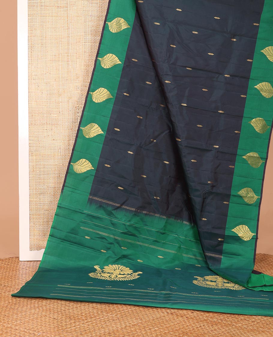 Blue zari buttas Kanchipuram silk saree, contrast leaf motifs zari border, and floral zari design pallu