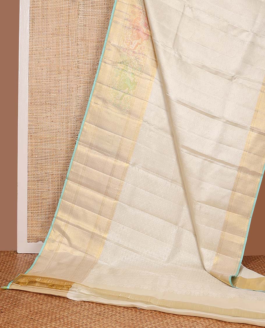 Cream jacquard Kanchipuram silk saree, zari border of mayil kann, and meenakari maan designs, and geometric pallu
