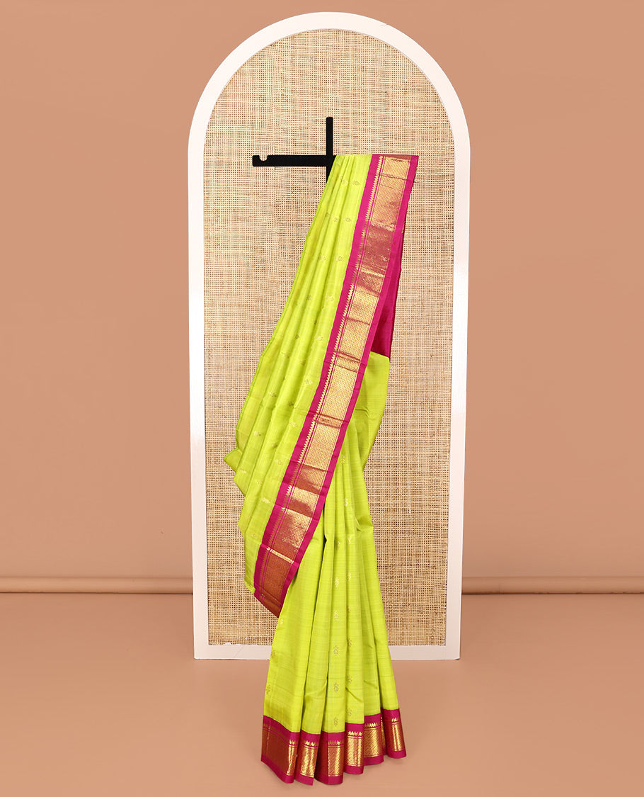 Green Kanchipuram Silk Saree, Meticulously Crafted with Zari Buttas All Over Its Body, Complemented by a Contrast One-Sided Korvai Border of Thilakam Mokku, and Puli Nagam Designs, Pallu of Zari Designs, and Comes Without a Blouse