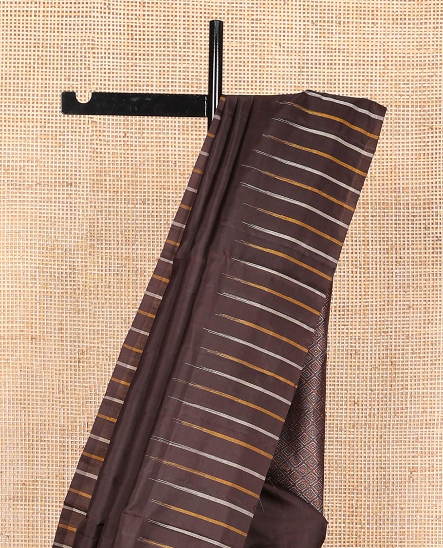 Broderless brown soft silk saree, pallu of thilakam mokku, paisa, kodi visiry, and jaal design