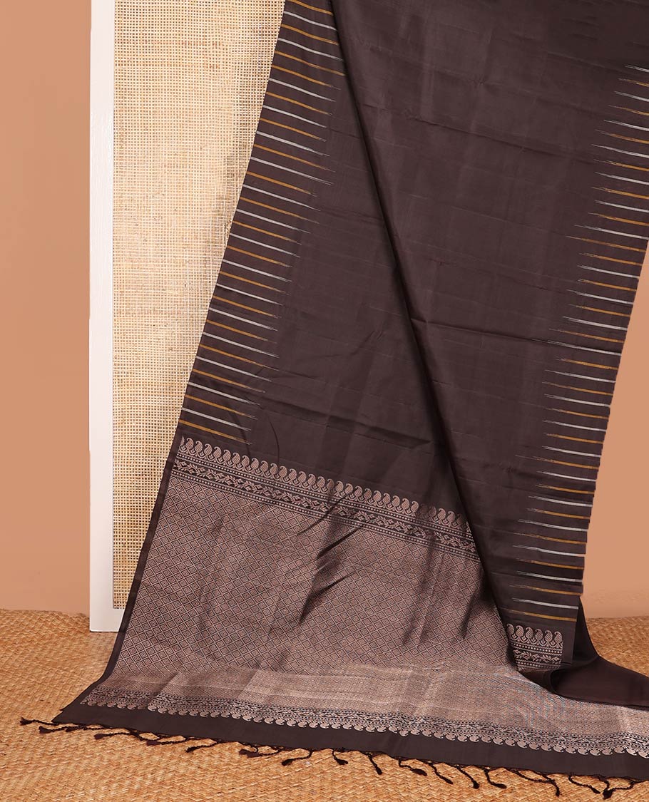 Broderless brown soft silk saree, pallu of thilakam mokku, paisa, kodi visiry, and jaal design