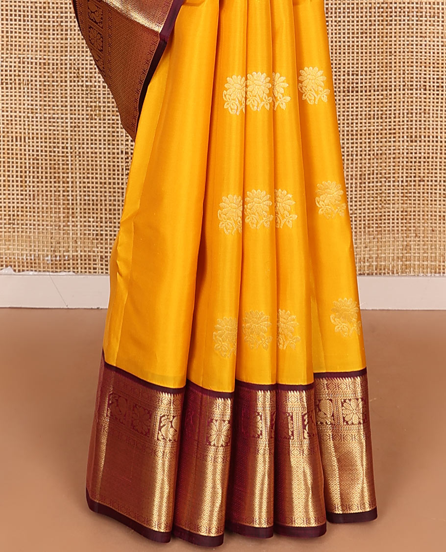 Yellow Vasundhara Lite Silk Mix Saree Dazzled with Zari Buttas, Complemented by a Contrast Border Featuring Rekku, Diamond, Muthu, Mayil, Kamalam, and Mayil Kann Designs, and Zari Elevated Jaal Pallu, and a Contrast Blouse