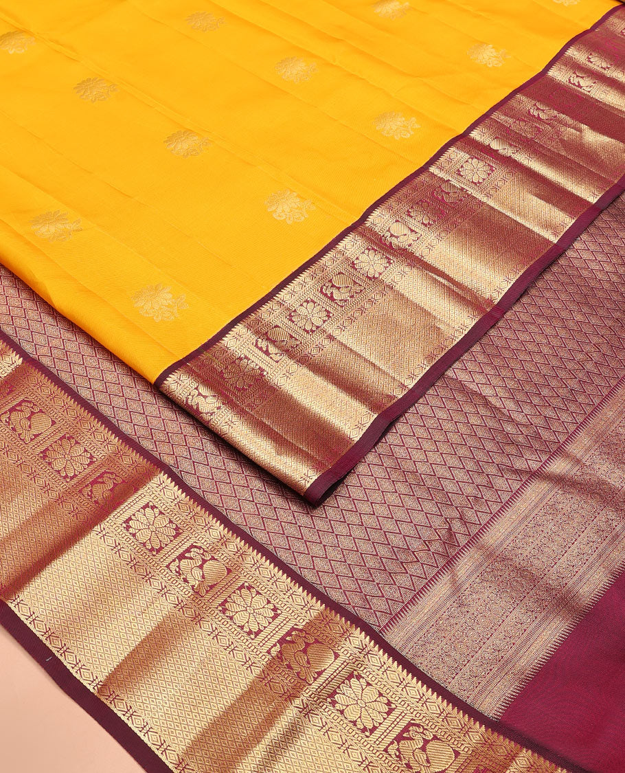 Yellow Vasundhara Lite Silk Mix Saree Dazzled with Zari Buttas, Complemented by a Contrast Border Featuring Rekku, Diamond, Muthu, Mayil, Kamalam, and Mayil Kann Designs, and Zari Elevated Jaal Pallu, and a Contrast Blouse