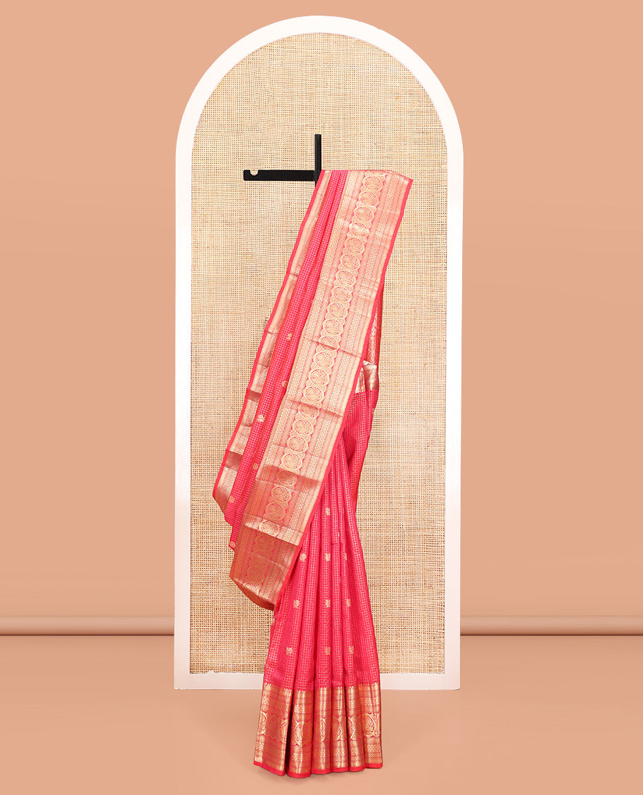 Red Vasundhara Silk Saree, Enriched with Zari Buttas and Checks All Over Its Body, Highlighted by Zari Border of Rekku, Mayil Kann, Vanki, Then Kuli Kann, and Round Mayil Designs, Grand Pallu of Butta Enclosed Checks, and Paired with a Matching Blouse