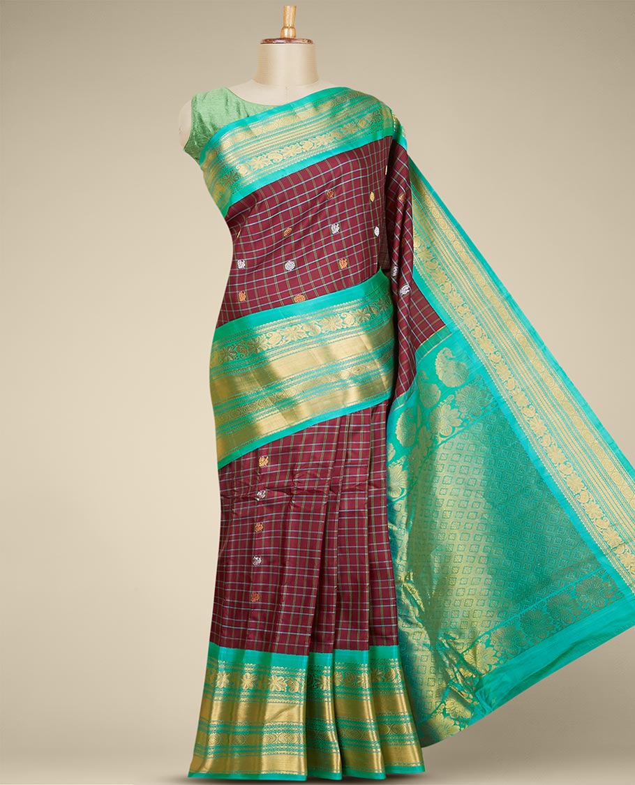 Maroon gadwal checked silksaree with mayil chakra buttas, contrast zari border & pallu of paisley, floral & argyle style