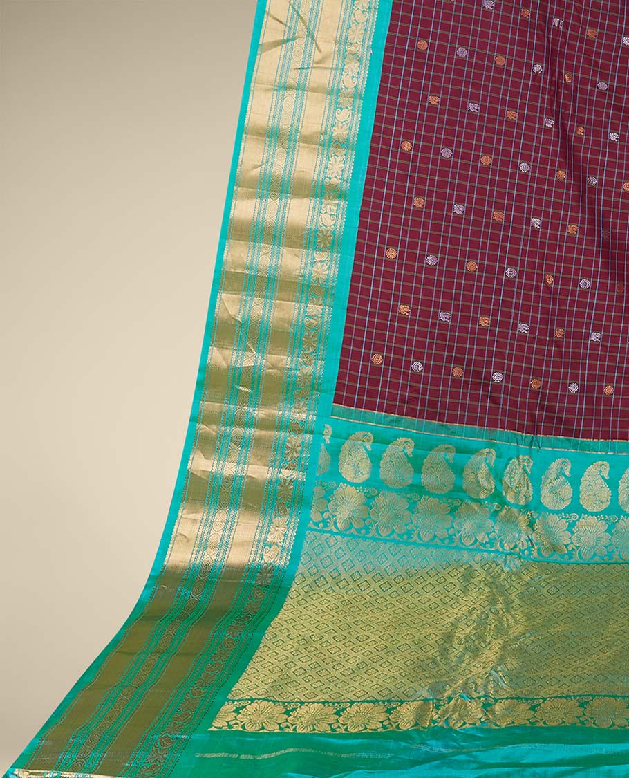 Maroon gadwal checked silksaree with mayil chakra buttas, contrast zari border & pallu of paisley, floral & argyle style