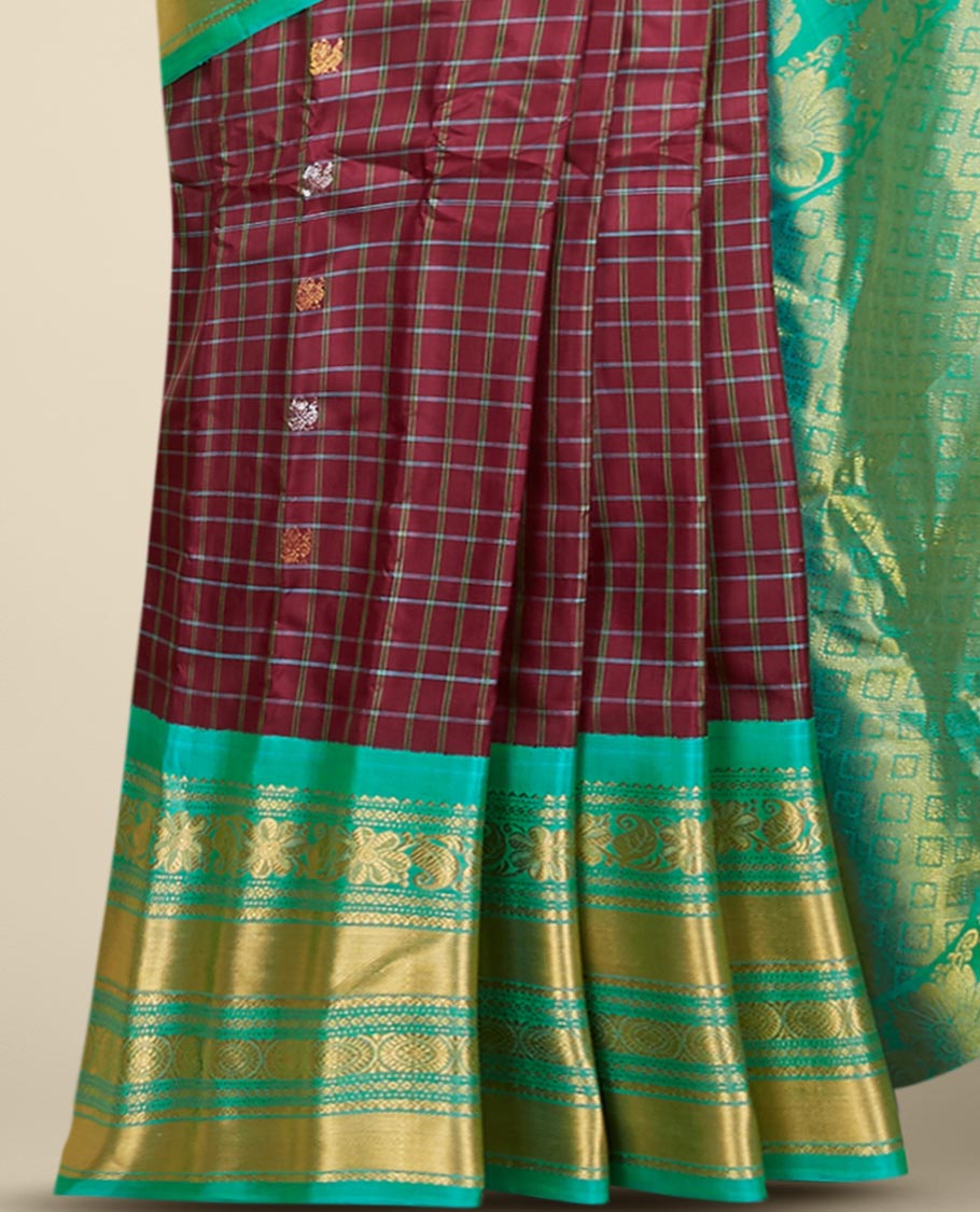 Maroon gadwal checked silksaree with mayil chakra buttas, contrast zari border & pallu of paisley, floral & argyle style