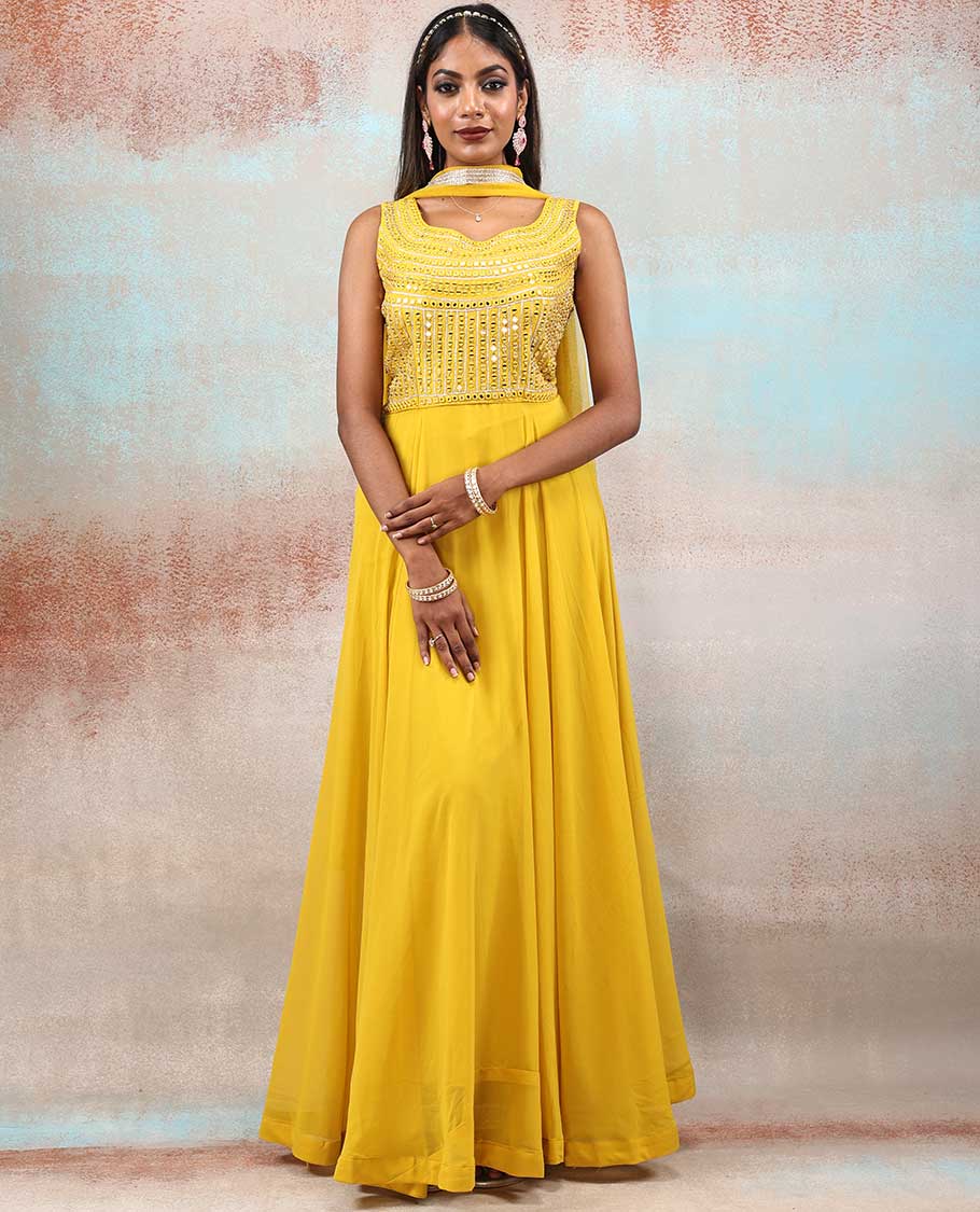 Bright yellow color Georgette Anarkali with full-front next mirror embroidered & net dupatta with embroidered border