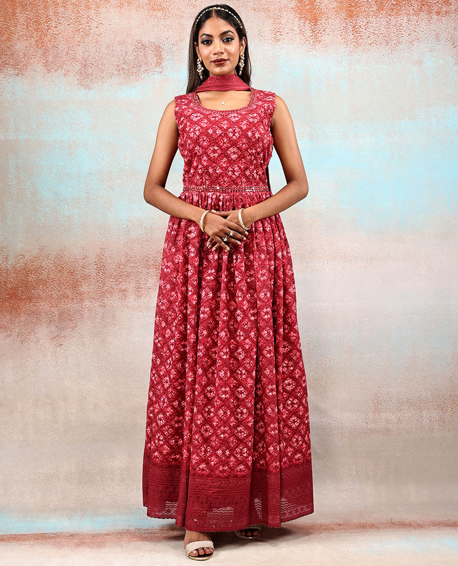 Red printed georgette Anarkali features intricate motifs, mirror work neck & thread embroidered border & dupatta