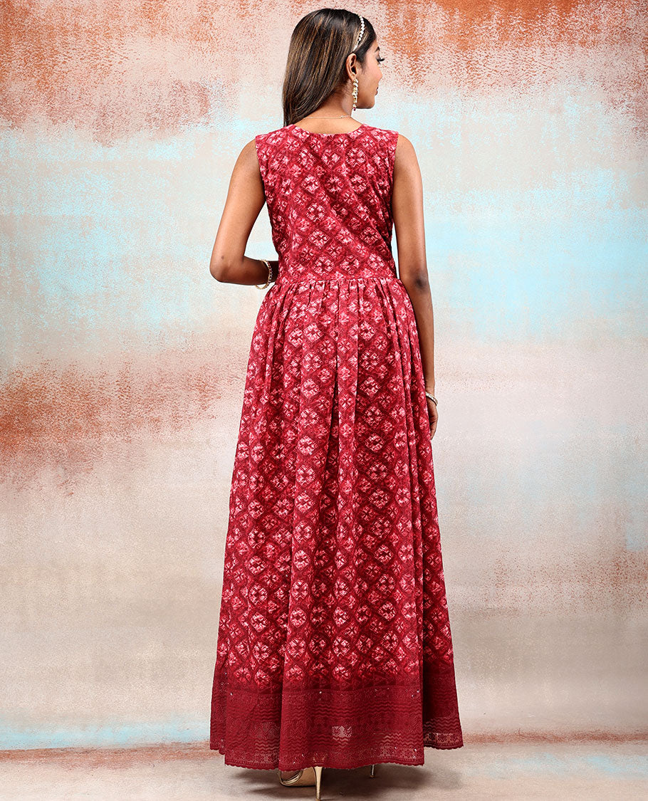 Red printed georgette Anarkali features intricate motifs, mirror work neck & thread embroidered border & dupatta