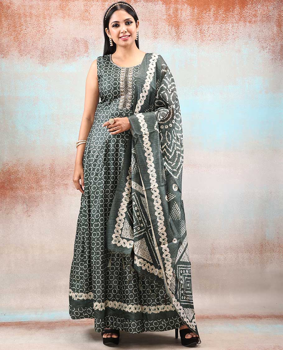 Green batik-style printed Chanderi Anarkali features all-over polka dots, neck embroidered & intricately printed dupatta