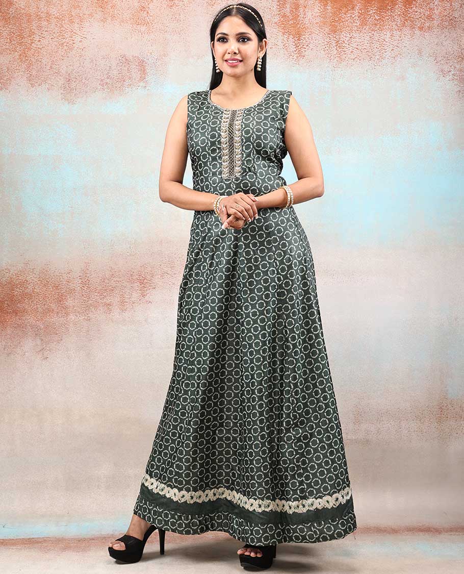 Green batik-style printed Chanderi Anarkali features all-over polka dots, neck embroidered & intricately printed dupatta