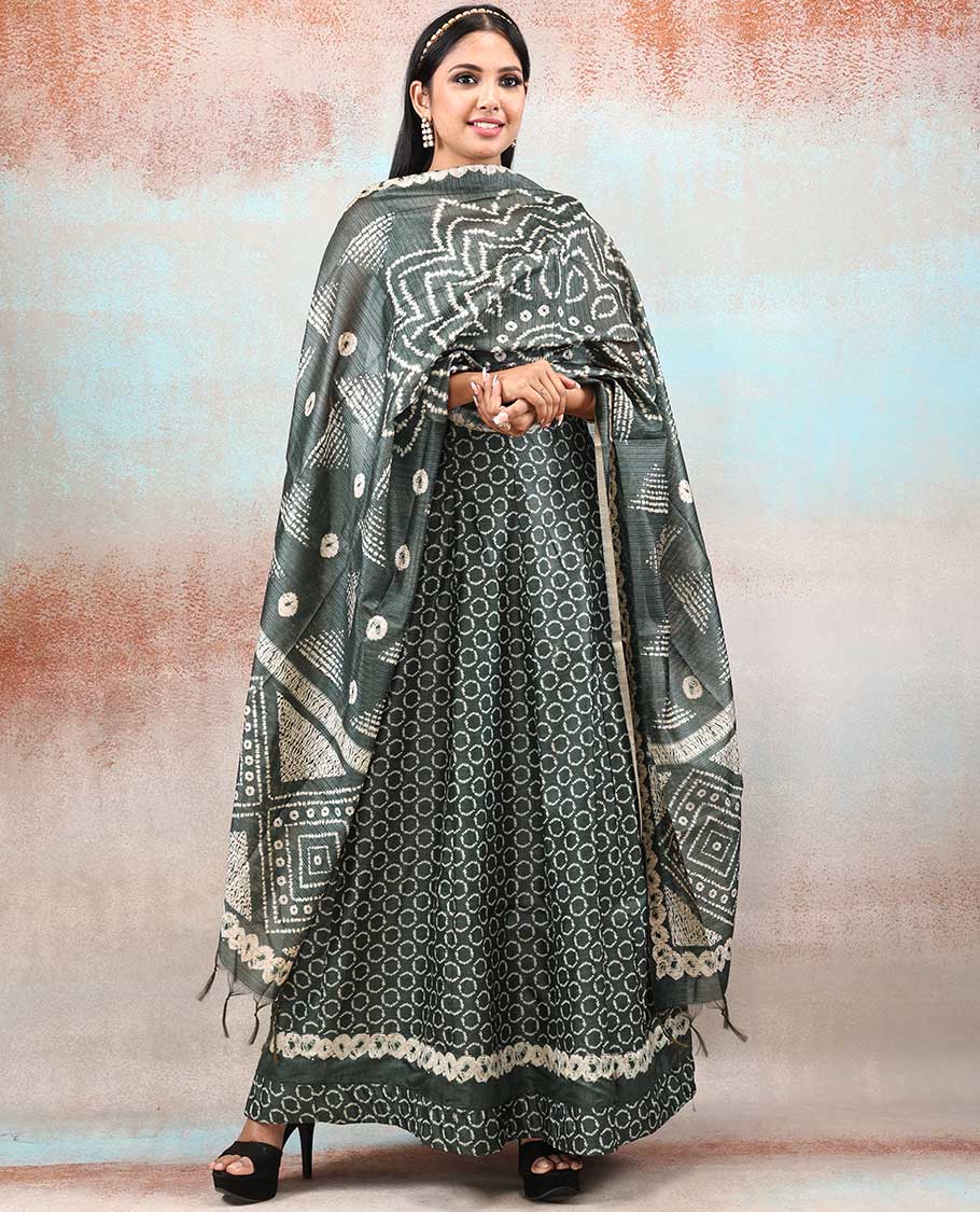Green batik-style printed Chanderi Anarkali features all-over polka dots, neck embroidered & intricately printed dupatta