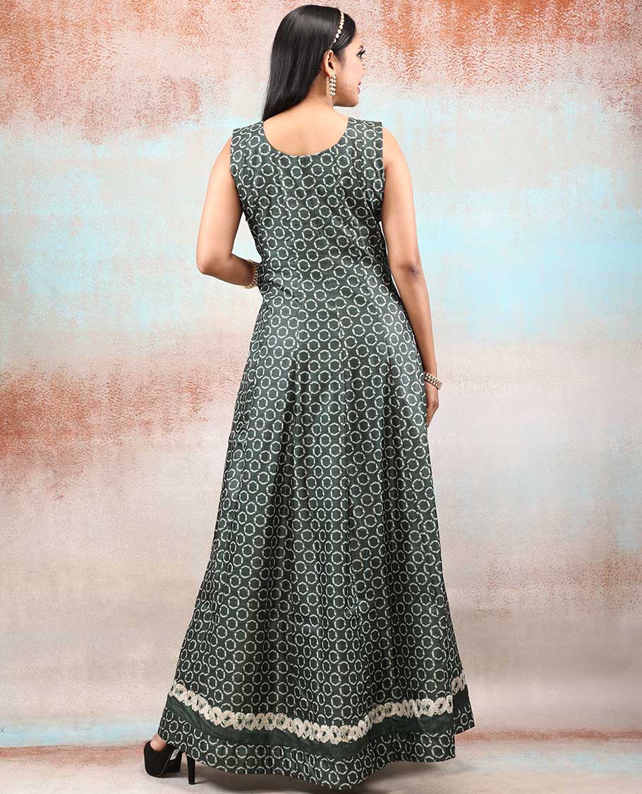 Green batik-style printed Chanderi Anarkali features all-over polka dots, neck embroidered & intricately printed dupatta
