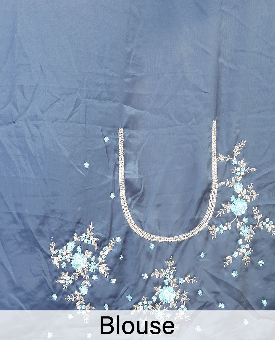 Grey embroidery satin silk saree bedecked with blue colour floral designs all over its body & pallu, embroidery border