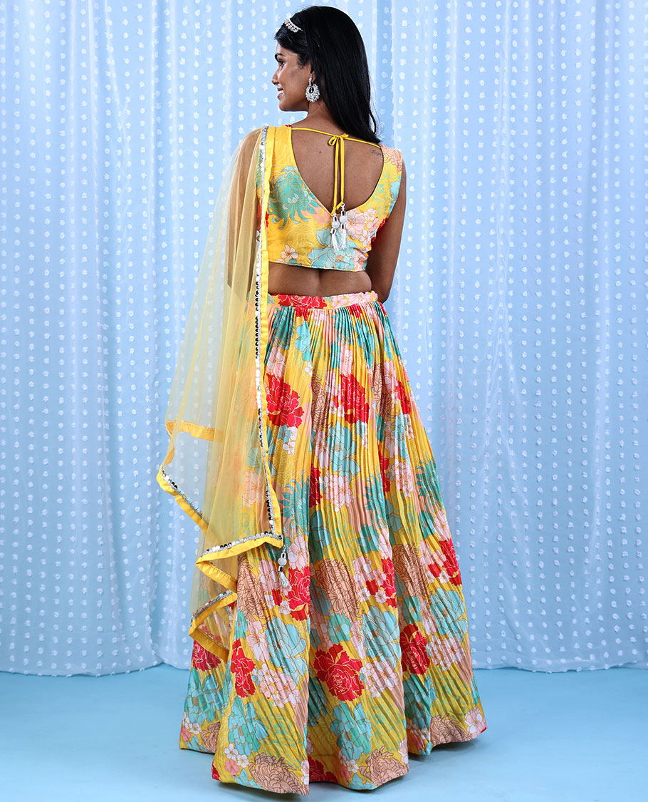 Yellow printed chiffon readymade lehenga with colorful floral skirt,V-neck sequin & sugar bead crop-top & net dupatta