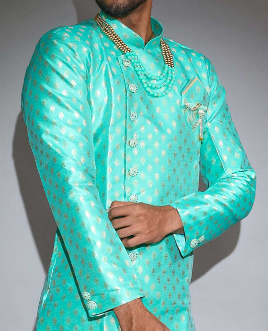 Green pure silk nawabi suit features intricate jacquard design full-sleeve kurta & contrast patiala-style pants