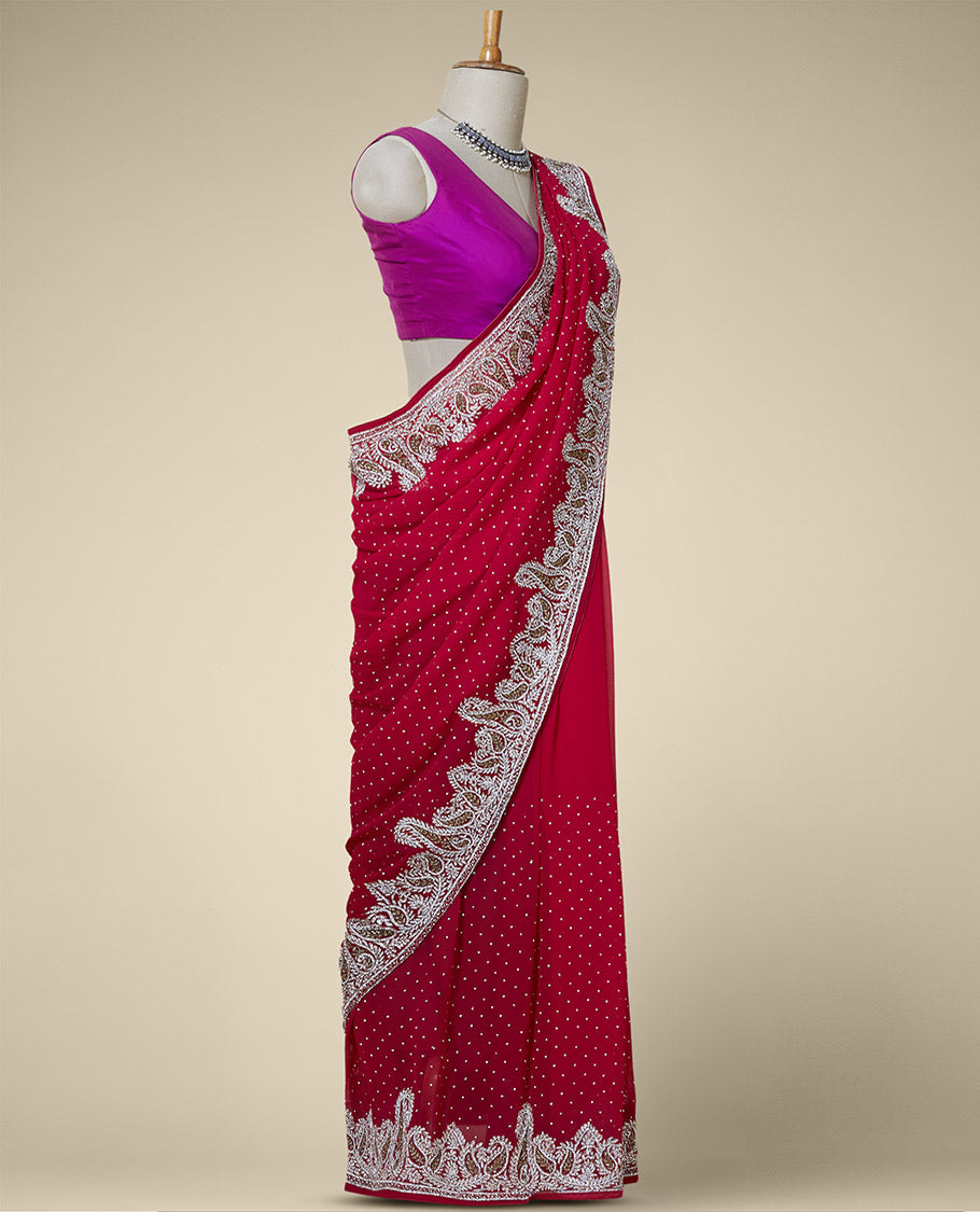Purple embroidered georgette saree with crystal stone on its body & pallu, white & gold stone paisley border
