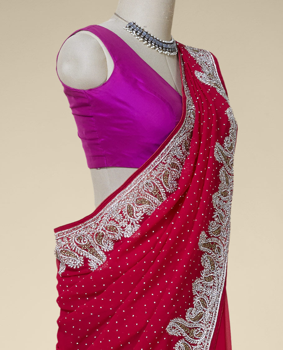 Purple embroidered georgette saree with crystal stone on its body & pallu, white & gold stone paisley border