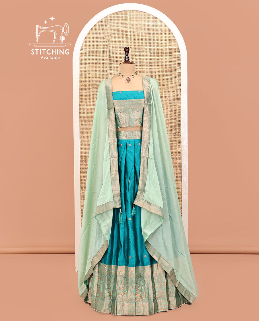 Peacock Blue Art Silk Half Saree Features Buttas Steeped Skirt, Complemented by Contrast Traditional Border, Contrast Blouse, and a Embroidery Scallop Dhavani