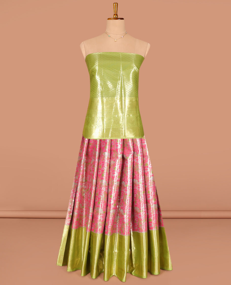 Pink Art Silk Pavadai Material Set, Elegantly Highlighted with Floral Jacquard Designs on Its Skirt, Complemented by a Contrast Traditional Zari Design Border, and Paired with a Contrast Jacquard Blouse
