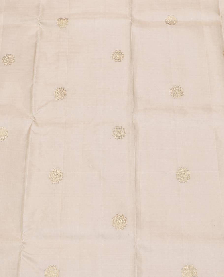 Cream Pure Silk Half-Saree, Enthralled with Zari Buttas All Over Its Skirt, Complemented by Contrast Wedding-Theme Border of Poo Chakram and Rudraksham Designs, Paired with a Contrast Blouse, and Comes with a Dhavani of Ogee Patterns