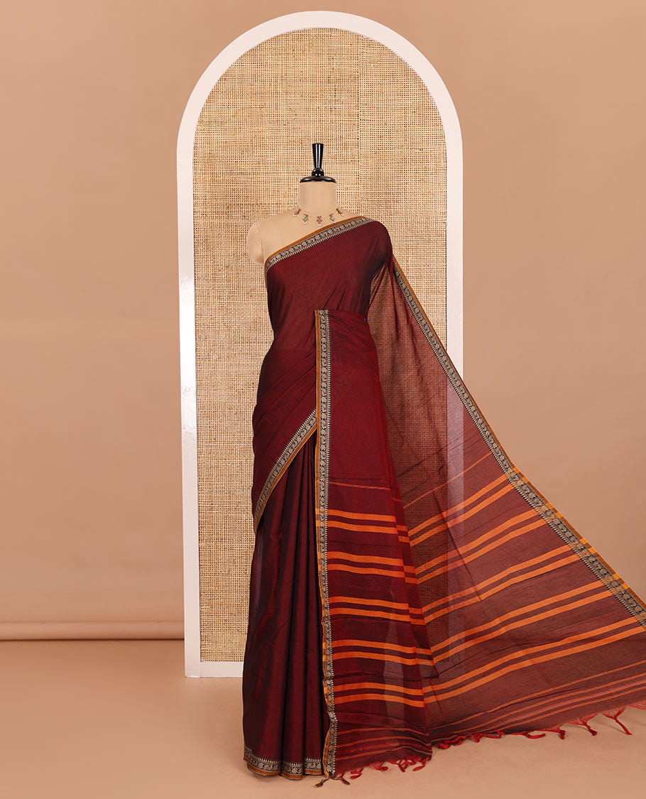 Maroon plain mercerised cotton saree, contrast temple traditional border, striped pallu, and a matching blouse