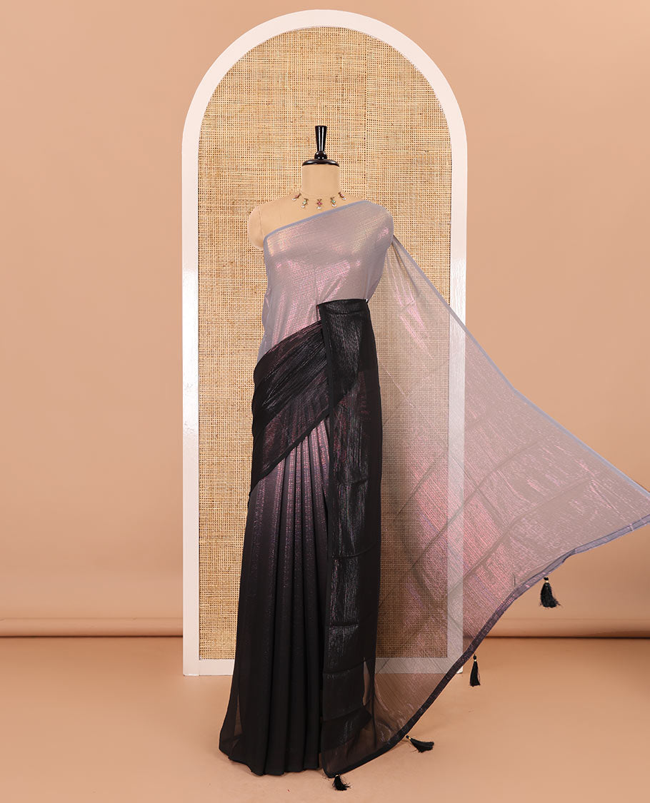 Borderless black ombre-toned gleaming Shimmer Georgette saree, self-pallu with tassels and a plain brown blouse