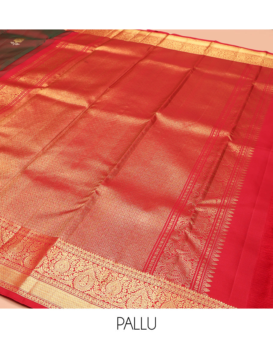 Maroon Kanchipuram Silk Saree, Beautified with Zari Buttas All Over Its Body, Complemented by Contrast Border of Kamalam, Thilakam, and Mayil Kann Designs, Grand Jaal Pallu, and Paired with a Contrast Blouse